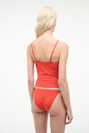 Red tankini top with spaghetti straps, ruched back and scoop neckline