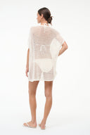 Ivory mesh coverup dress with orange stripe pattern, draped back and scalloped hem.
