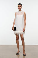 Ivory mini dress with sleeveless sheer yoke and feather trim hem
