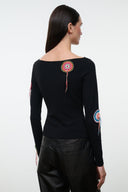 Black long-sleeve top with multicolor circular embroidery and dangling tassels, back