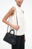 Black Maude mini carryall bag with adjustable shoulder strap and top handle