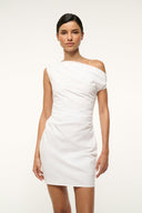 White mini dress with asymmetrical off-shoulder neckline, fitted waist