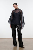 FIA black V-neck top with sheer cape-like sleeves and relaxed silhouette