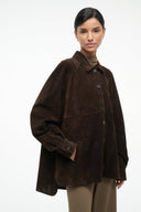 Dark brown suede shirt with pointed collar and dark buttons, long sleeves, flap chest pocket.