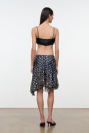 Silk skirt in navy with multicolor dot print and uneven layered hem, back view