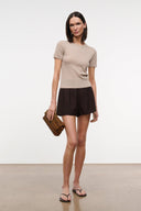 Stone beige cashmere tee with crew neck and short sleeves, side front view