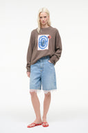 Relaxed crewneck cashmere sweater with blue square graphic patch and ribbed hem cuffs
