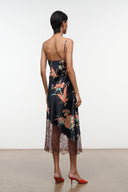 Black silk dress with floral tapestry print, lace-trim hem, spaghetti straps (back)