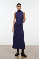 Midnight sleeveless turtleneck knit top with ribbed hem, deep navy blue