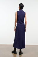 Midnight pleated midi skirt, back view, elastic waistband