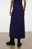 Midnight pleated midi skirt hem with fine vertical pleats