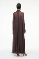 Brown maxi dress from back view with long sheer sleeves and flowing silhouette