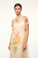Front view peach floral maxi dress with round neckline and layered ruffle skirt