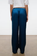Back view of blue silk wide-leg pant with smooth seat and relaxed legs