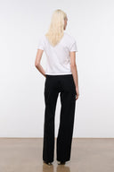 Black relaxed jeans with wide leg, belt loops, front fly, and front pockets