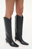 Pair of black tall western boots with pointed toe and slim stiletto heel