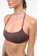 Dark chocolate bikini top with halter straps and red bead trim, front view