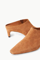 Tan suede mule with open back, almond toe, and low block heel