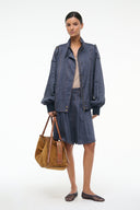 Women’s chambray jacket in dark blue with snap buttons, collar, and patch pockets