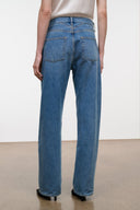Medium-wash boyfriend jeans with two back patch pockets and belt loops