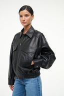 Black leather bomber jacket with stand collar, zip front, flap pockets, ribbed cuffs