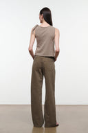 Back view of sleeveless draped top with shoulder tie, sesame beige