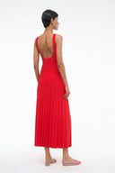 Red sleeveless pleated midi dress with low scoop back and fitted bodice