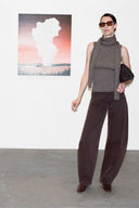 Women's dark gray sleeveless turtleneck with high neck and wide-leg dark pants