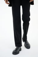 Black leather-look ankle boot with rounded toe and chunky lug sole