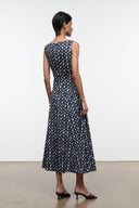Navy sleeveless midi dress with abstract yellow dot print, scoop back and gathered waist