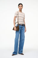 Truffle suede shoulder bag with short handles, carried at side