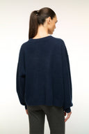 Navy cashmere crewneck sweater, back view with ribbed cuffs and hem