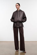 Dark brown hooded leather jacket with front zipper and drawstring waist, long sleeves