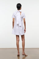 White mini dress with tied back bow at the neck and short sleeves