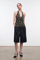 Sleeveless speckled halter top with deep V neckline and draped front
