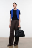 Dark oak wide-leg pants with elastic waistband and loose, flowing silhouette