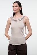 Front view of women's champagne sleeveless cowl-neck fitted top with draped neckline