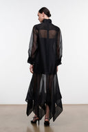 Black sheer dress back view with high collar and layered asymmetrical hem