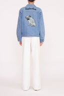 Medium-wash oversized denim jacket with dog graphic on back and button front