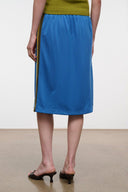 Blue midi skirt with olive side stripe and elastic waist; straight mid-calf hem.