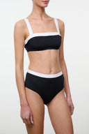 Black and white bikini top with wide contrast straps and straight neckline