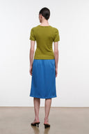 Blue midi skirt with elastic waistband and olive trim stripe; straight mid-calf hem.