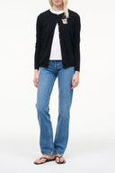 Black cashmere cardigan over white tee, button front and dog graphic patch