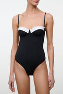 Black one-piece swimsuit with white contrast underbust panel, thin straps