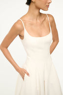 Ivory maxi dress with spaghetti straps and square neckline, fitted waist and gathered skirt