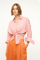 Faded blush linen button-up top with front knot detail and wide rolled sleeves