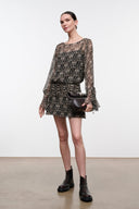 Speckled black and brown mini dress with long sheer sleeves, waist belt, and flared cuffs