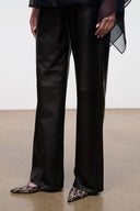 Black wide-leg trousers with SEBASTIAN porcupine quill slingback shoes, pointed toe