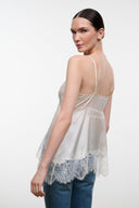 Ivory silk camisole top with thin straps and blue lace back hem