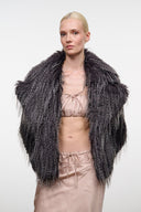 Dark gray shag fur jacket on model, wide collar, open front